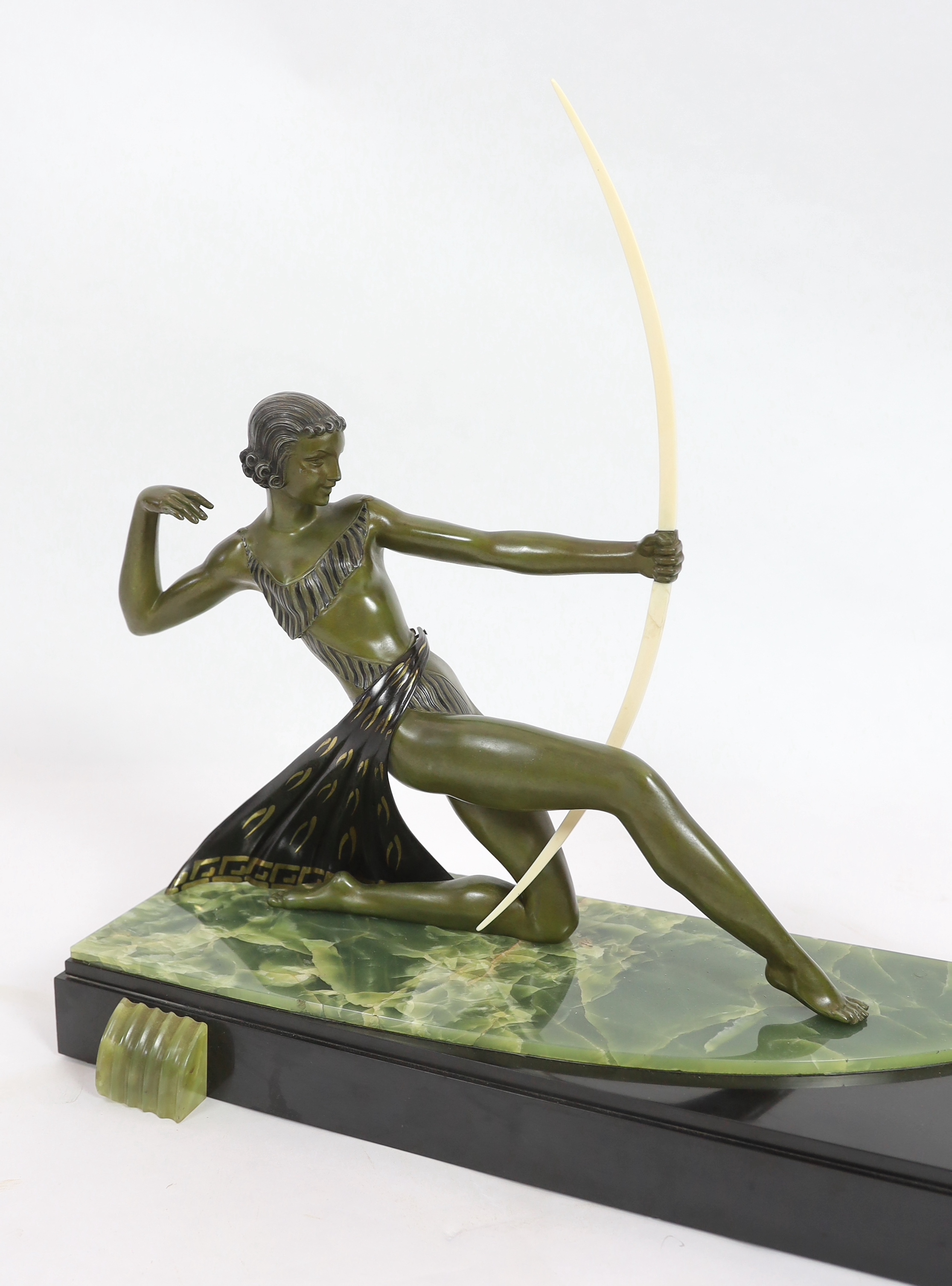 Attributed to Ugo Cipriani (Italian, 1887-1960). An Art Deco bronzed spelter group of an archer shooting at two antelopes, 82cm wide, 24cm deep, 55cm high